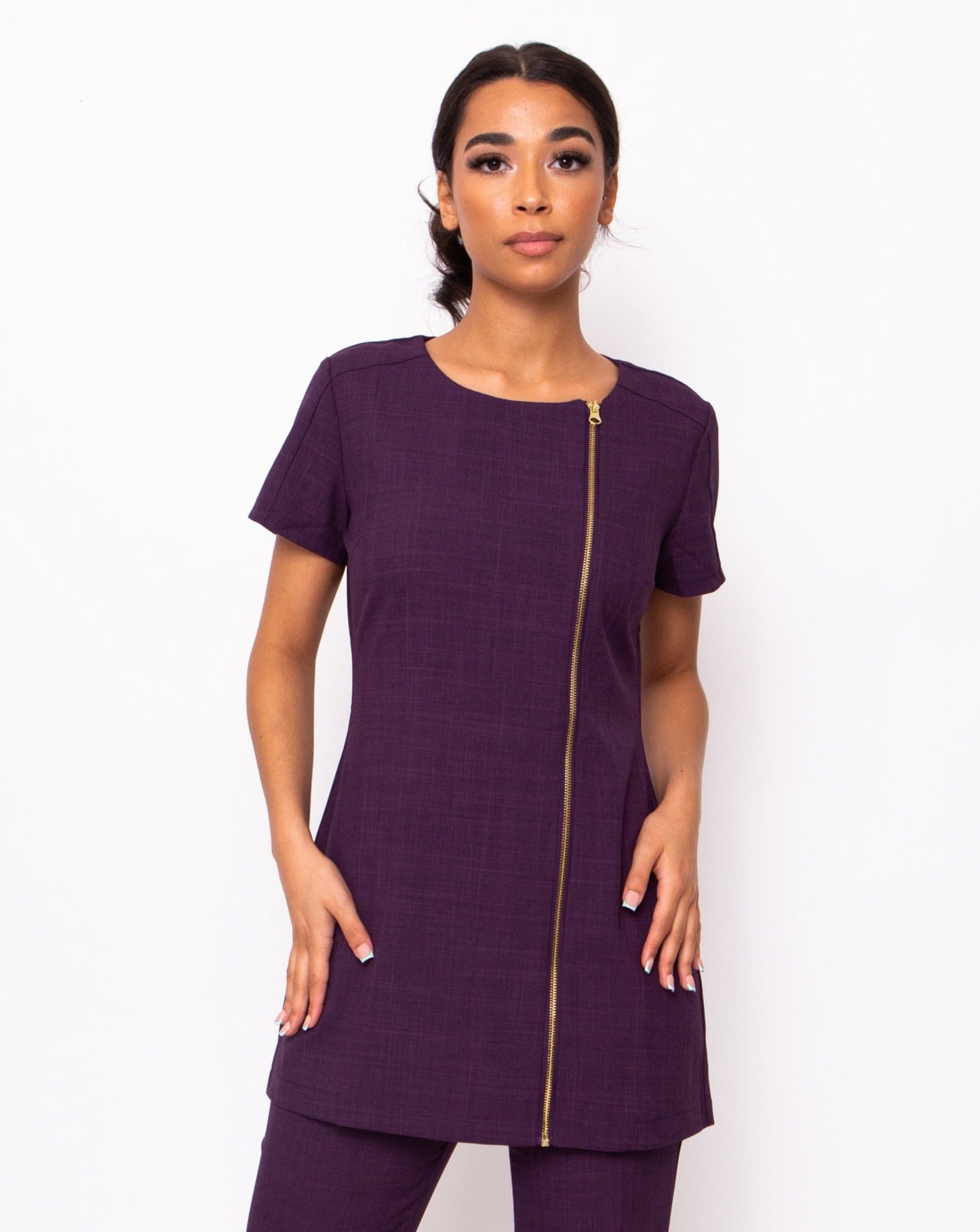 plum spa and beauty uniforms with gold zip