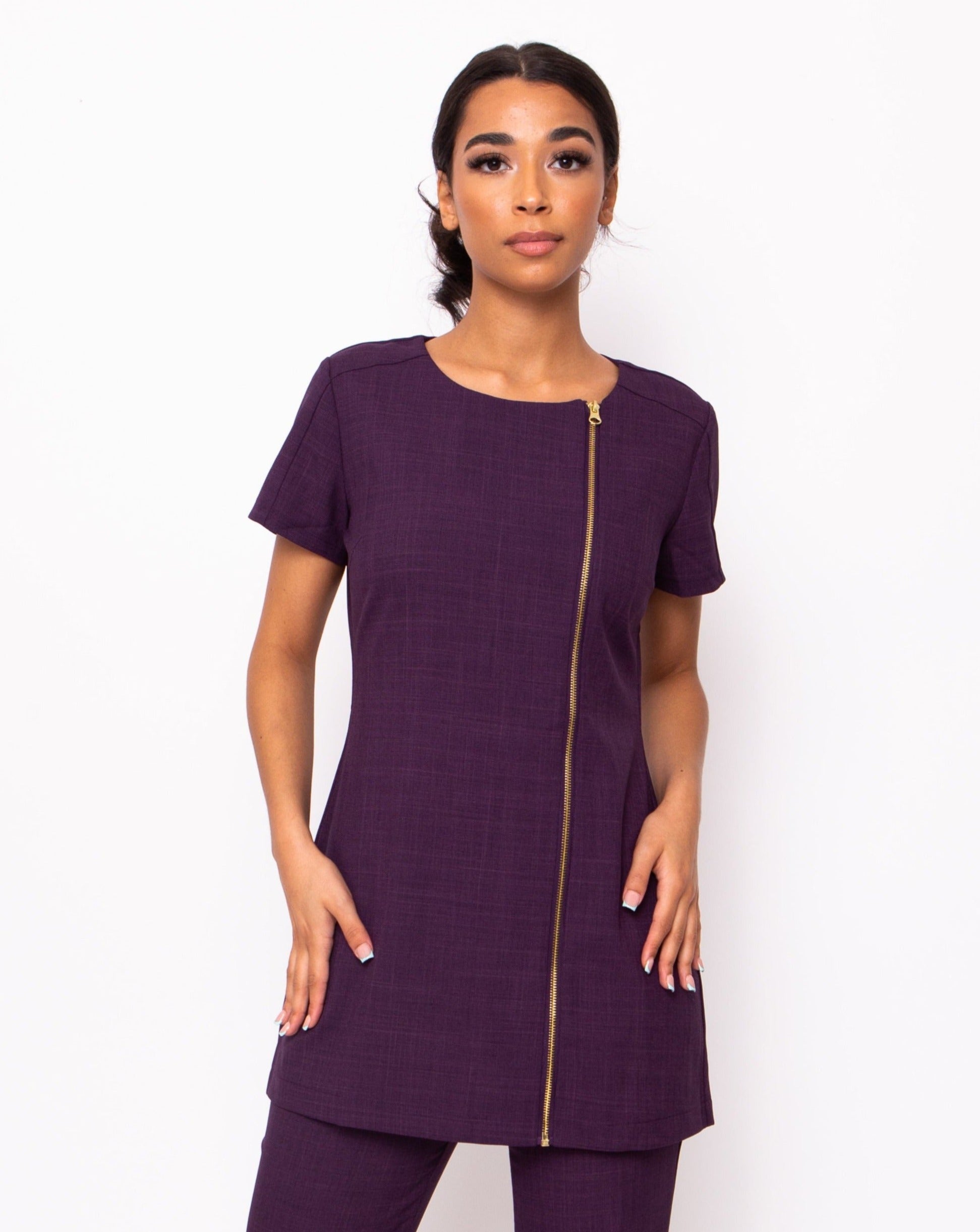 plum spa and beauty uniforms with gold zip